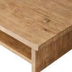 Close-up showing four pegged joinery details on oak tabletop with wood grain variation