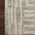 Flat lay close-up of rug corner highlighting the texture contrast between raised and flat weave