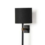 Maurice Sconce front view placed on white background with visible slim pole and brass fixture