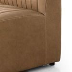 Close-up showing smooth side leather panel with subtle natural texture near base