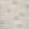 Natural-colored rug with subtle geometric patterns in varying tonal stripes and soft fading