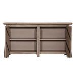 Interior of Marci Sideboard with open doors featuring two shelves and metal hinges