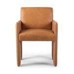 Side angle emphasizing boxy leg design and recessed leather panel beneath armrest
