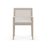 Straight-on front close-up of Sherwood Brown armchair showing clean teak frame and light stone cushion