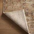 Back side of the rug folded to show the woven construction and color consistency on the underside