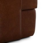 Close-up of lower side panel seam and chair base curve