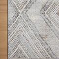 Close-up shot of the rug’s corner flat on wood floor emphasizing pattern details and tight edge binding