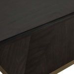 Close-up of dark wood grain texture and subtle cerused finish on table surface and base