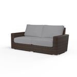 Montecito Loveseat outdoor sofa with cognac multi-colored resin wicker frame and gray cushioned seat and back