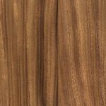 Close-up showing fine grain texture and natural color variations of guanacaste wood