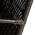 Close-up detail of hand-woven dark rattan wrapping a metal footrest on bar stool