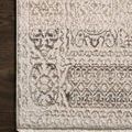 Vintage style rectangular ivory and silver rug with traditional distressed pattern and subtle high-low texture
