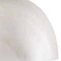 Close-up detail of brushed brass finish on lamp base with soft lighting