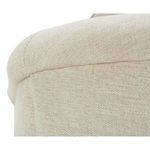 Curved top edge of chair back with detailed fabric weave and seam