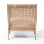Rear view of Kenzo Chair emphasizing cane webbing panel framed by light wood