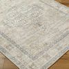 Close-up on Lila Slate/Amber rug corner highlighting textured weave and detailed border pattern on hardwood floor