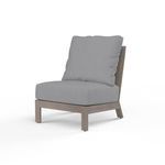 Laguna Armless Club chair with hand-brushed driftwood-look aluminum frame and gray outdoor cushions