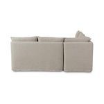Back view of modular banquette with smooth fabric slipcover and cushion tops visible