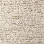 Extreme close-up highlighting the looped boucle fabric and speckled fibers