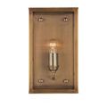 Close-up angled view showing mounting hardware and knurled side knob on antique brass finish