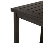 Close-up of tabletop corner highlighting woodgrain texture and seam detail