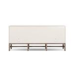 Back of Fiona Sideboard showing plain ivory panel and supportive mahogany base