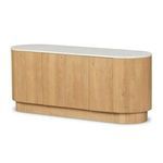 Close-up of top marble edge with soft rounded corners atop oak base