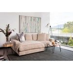Plunge sectional styled in natural light room near large window with pillows and throw blanket