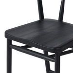 Close-up showing smooth black oak seat with subtle grain texture on the Buxton Drifted Oak Bar Stool