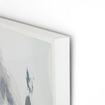Corner close-up of white frame and abstract brushstrokes with shadow on white wall