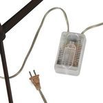 Fordham Floor Lamp lit in a modern room setting with other designer lamps