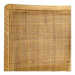 Close-up detail of natural rattan weave texture on chair backrest