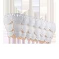 Oval chandelier featuring overlapping semi-translucent white sand dollar shapes in bone china with warm light