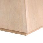 Close-up detail of the light oak tapered pedestal base with visible wood grain