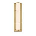 Blaine sconce lit from side angle highlighting warm glow through the milky glass diffuser