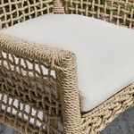 Close-up of armrest corner spiraled hyacinth rope detail with cushion edge visible
