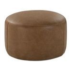 Round tan leather ottoman with smooth surface and stitched seams, low profile accent pouf