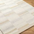 Close-up angle of Max rug showing texture and dense wool pile on wooden floor