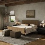 Richard Bed styled in bedroom with beige bedding, dark nightstands, and soft natural light from window
