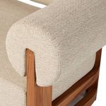 Close-up of rounded top backrest cushion and teak wood frame joinery