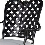 Detail of lattice back with floral medallion and curved armrest