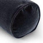 Close-up of velvet texture and rounded end cap of navy bolster pillow