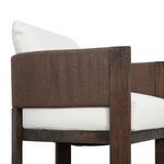 Close-up of chair back corner showcasing wood frame and woven cording detail
