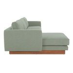 Side profile of Vernon sectional emphasizing thick removable cushions and wooden plinth base