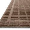 Close-up angled view highlighting the raised linear pattern and texture of the cocoa rug