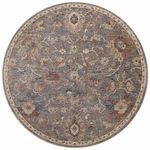round rug with the same floral motif and muted blue background with cream and rust accents