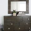 Straight-on view of Linea dresser with large mirror, contemporary decor, and fur rug visible