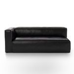 Front view of black leather left-sectional emphasizing seat cushions and boxy armrest