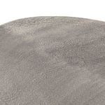 Overhead close-up view of textured raw nickel finish on oval tabletop