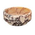 Second view of primary bowl showing slight variation in marble pattern from an angled side